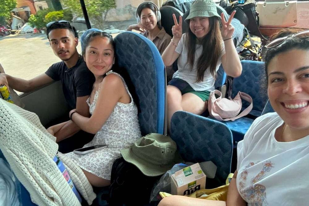 Group taking a picture while sitting