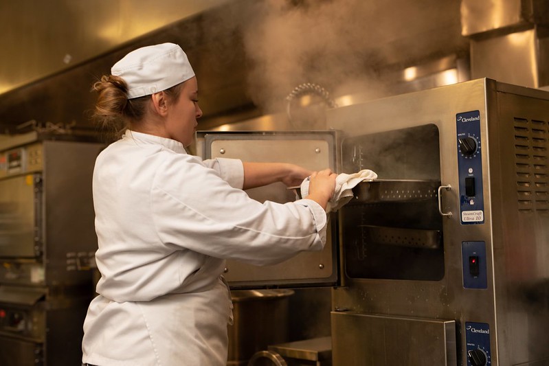 Culinary Student at oven