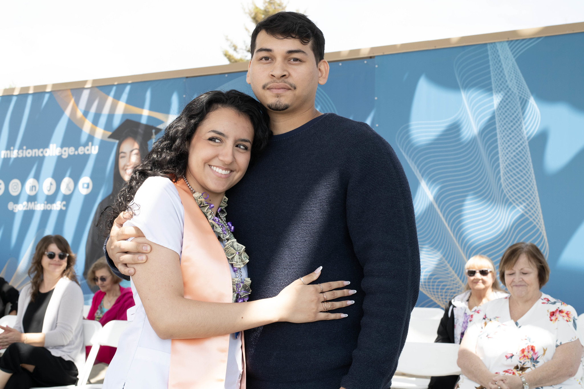 Nursing graduate with family