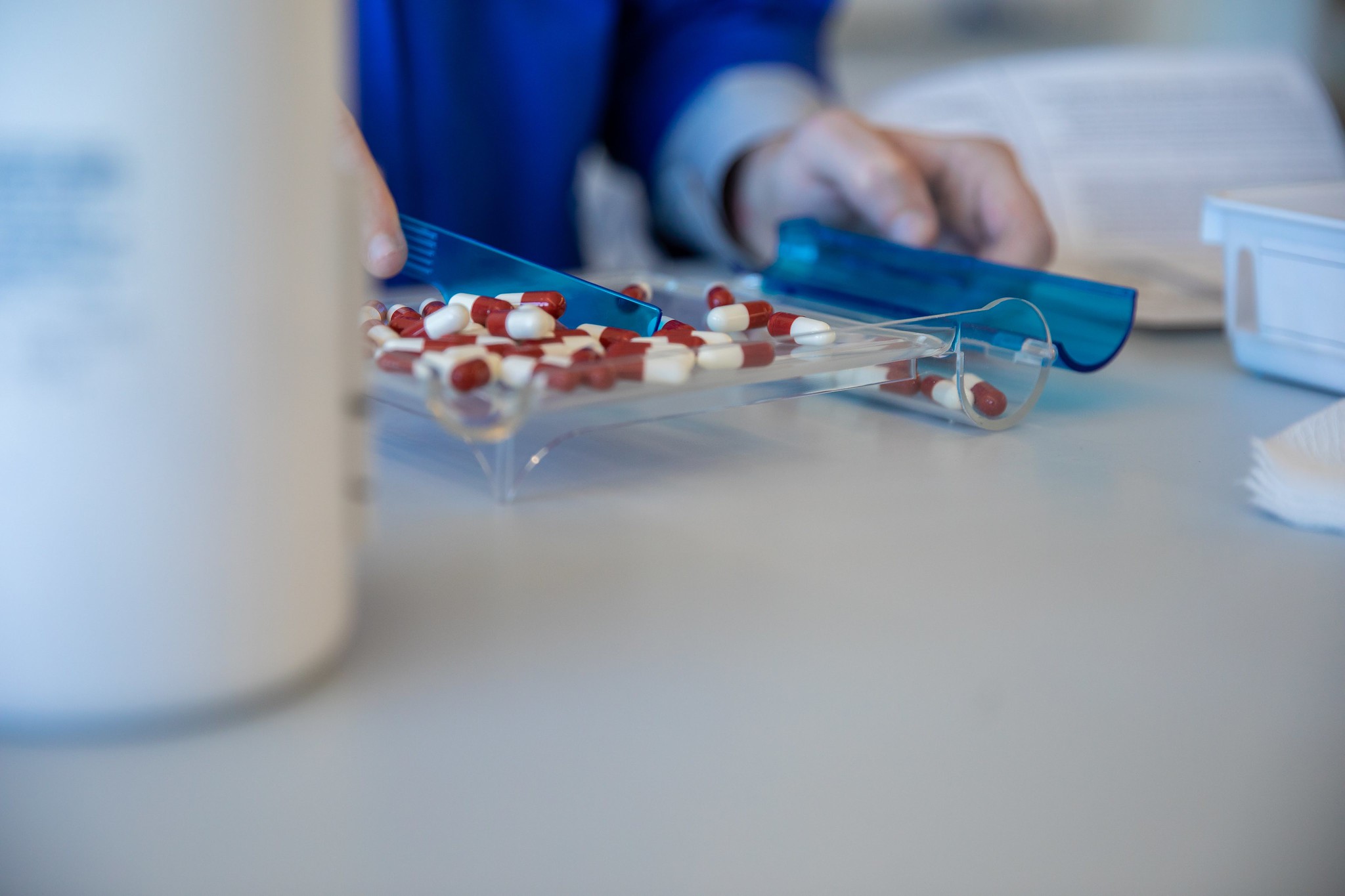Pharmacy technician student counting pills