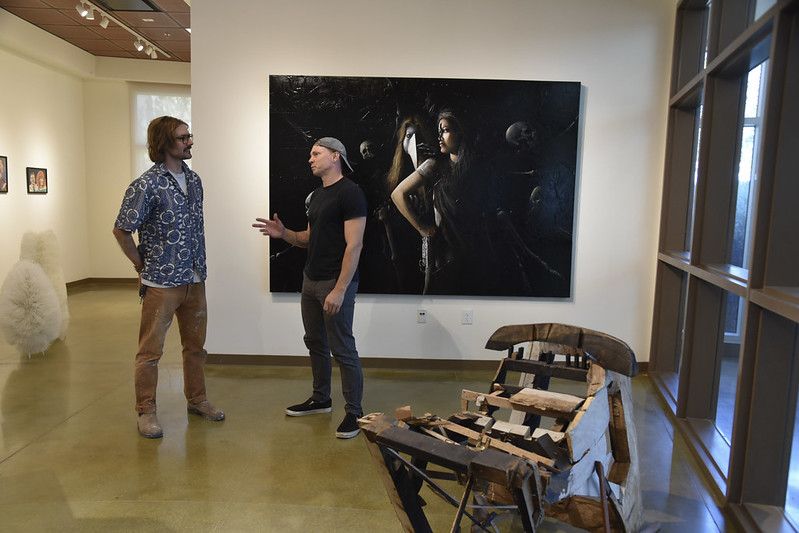 Two art students in a gallery