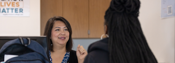 Employee talking to student