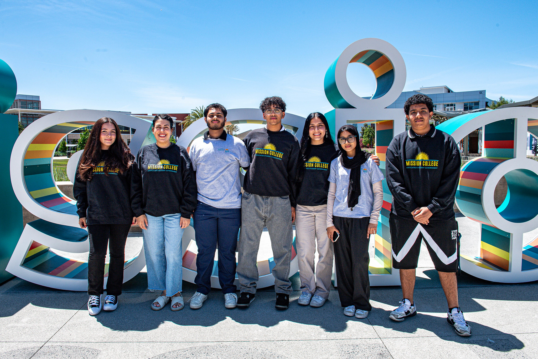 Mission College ASG in front of Mission sign
