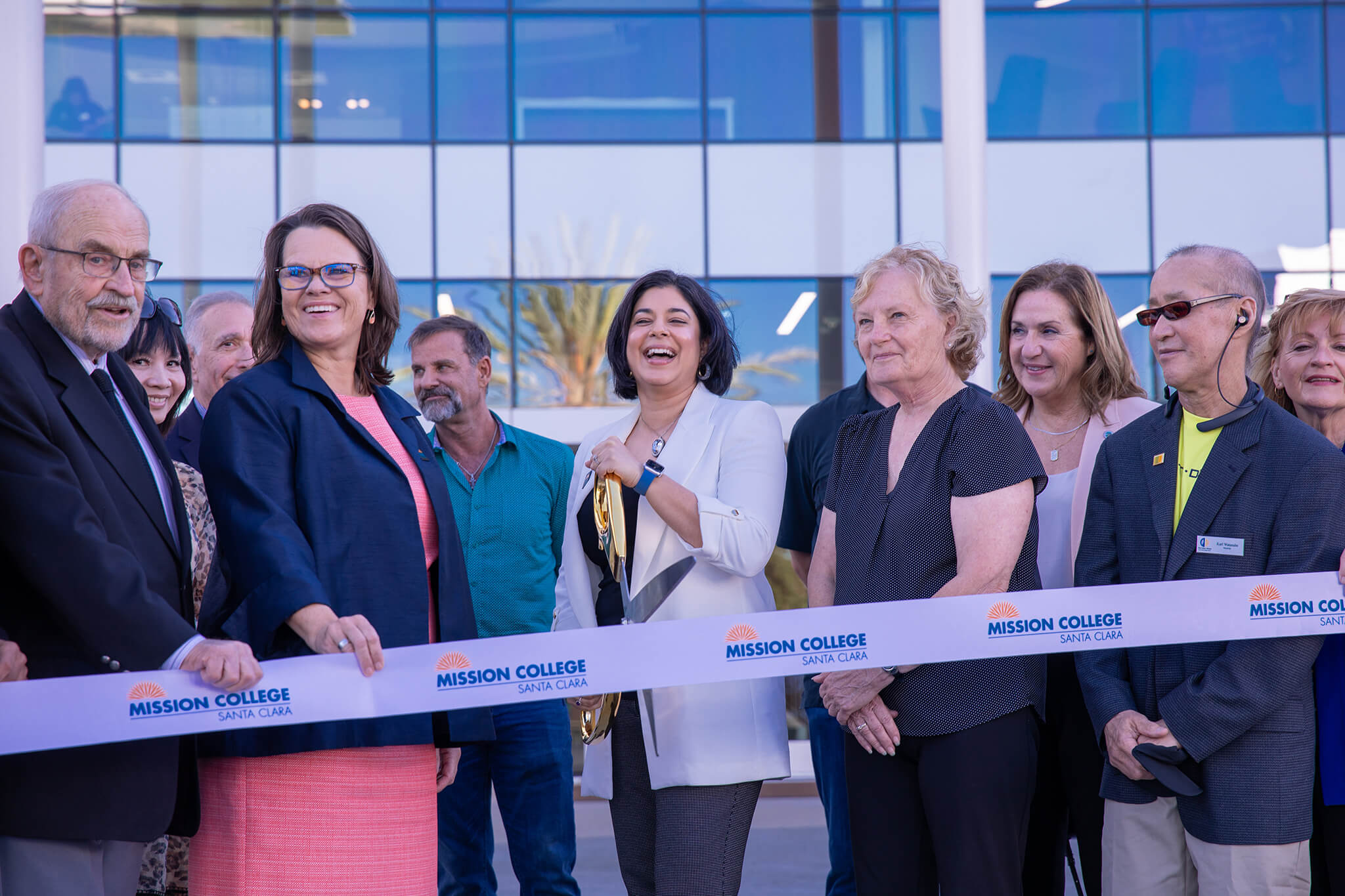 People at a ribbon cutting ceremony