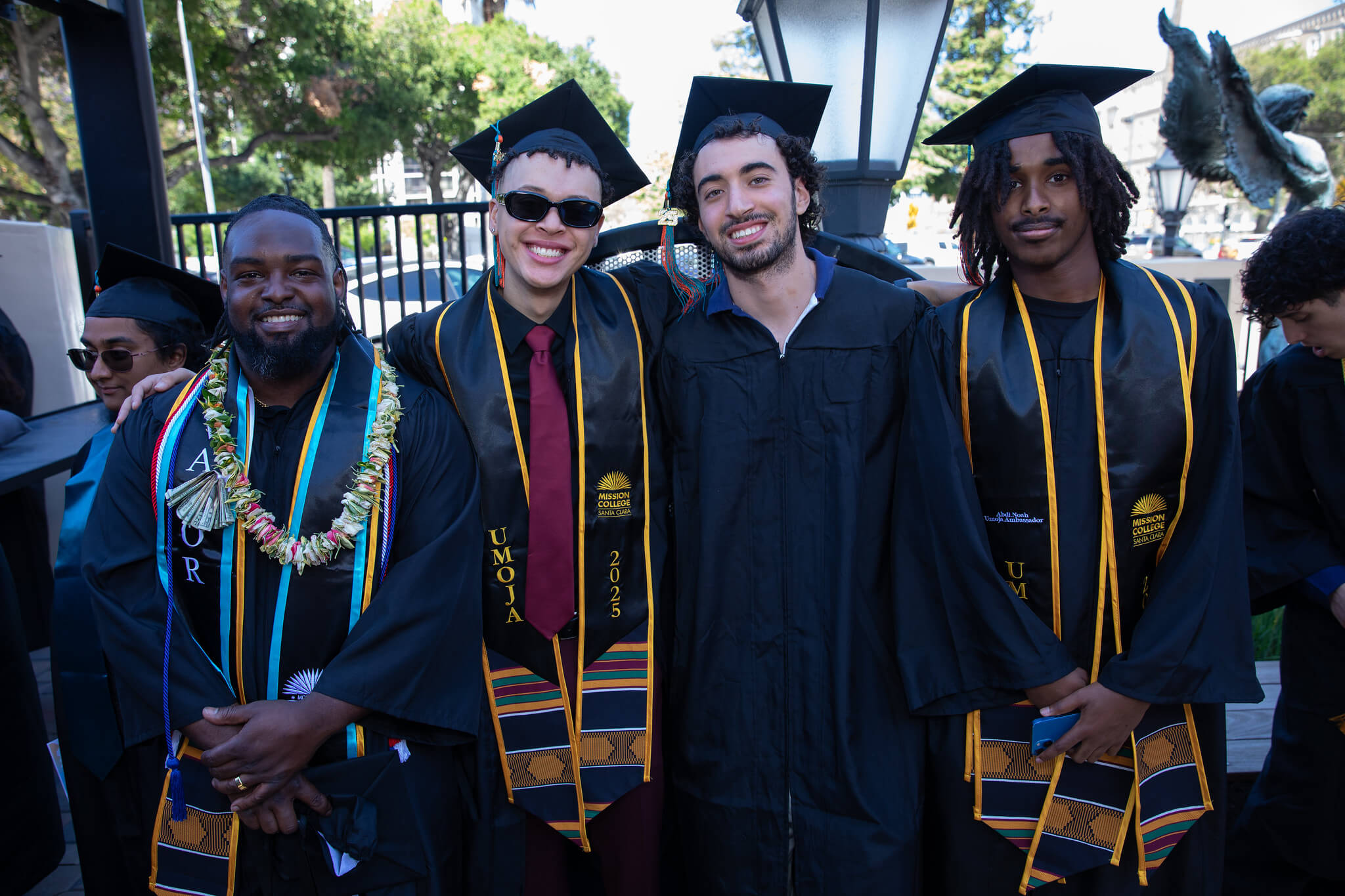 Mission College graduates posing for picture
