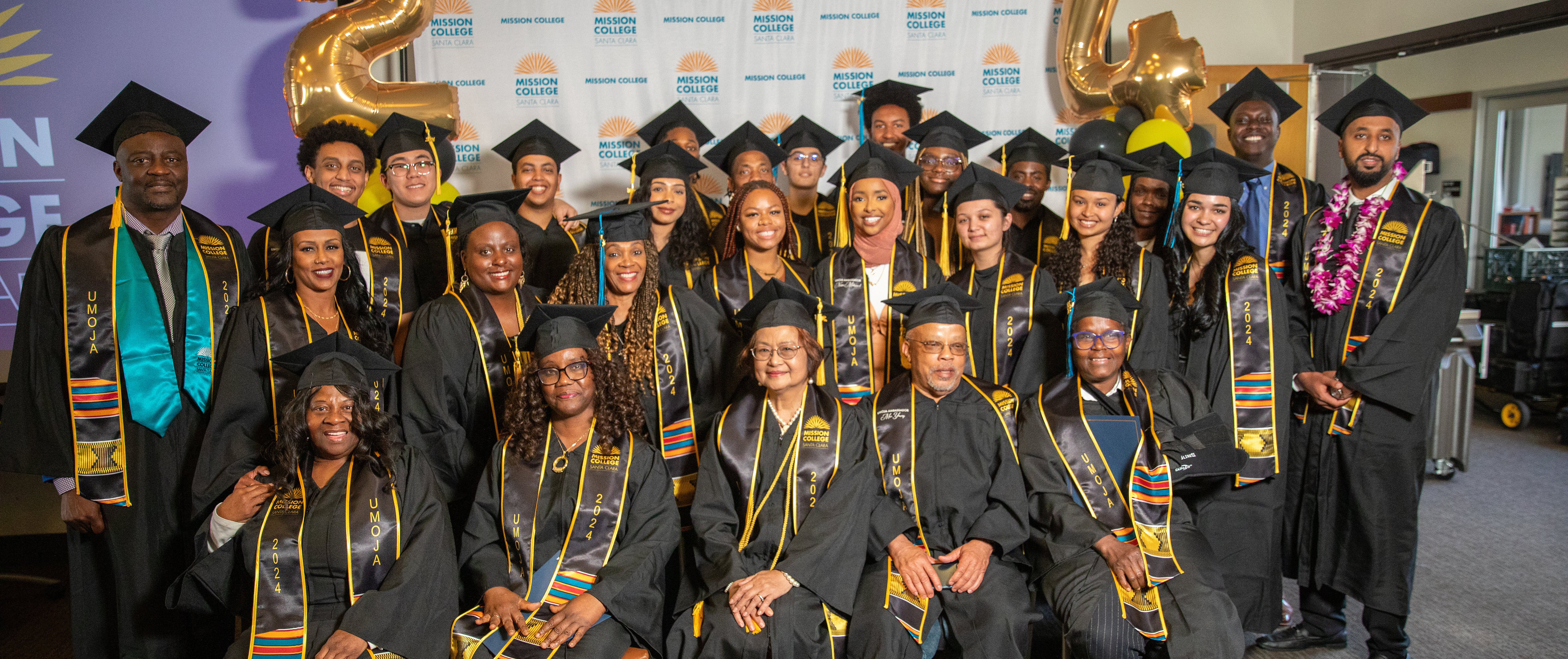 Umoja grads posing for picture
