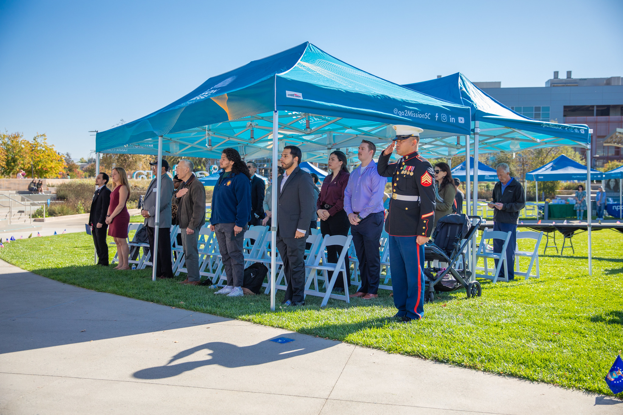Veteran event participants standing at attention